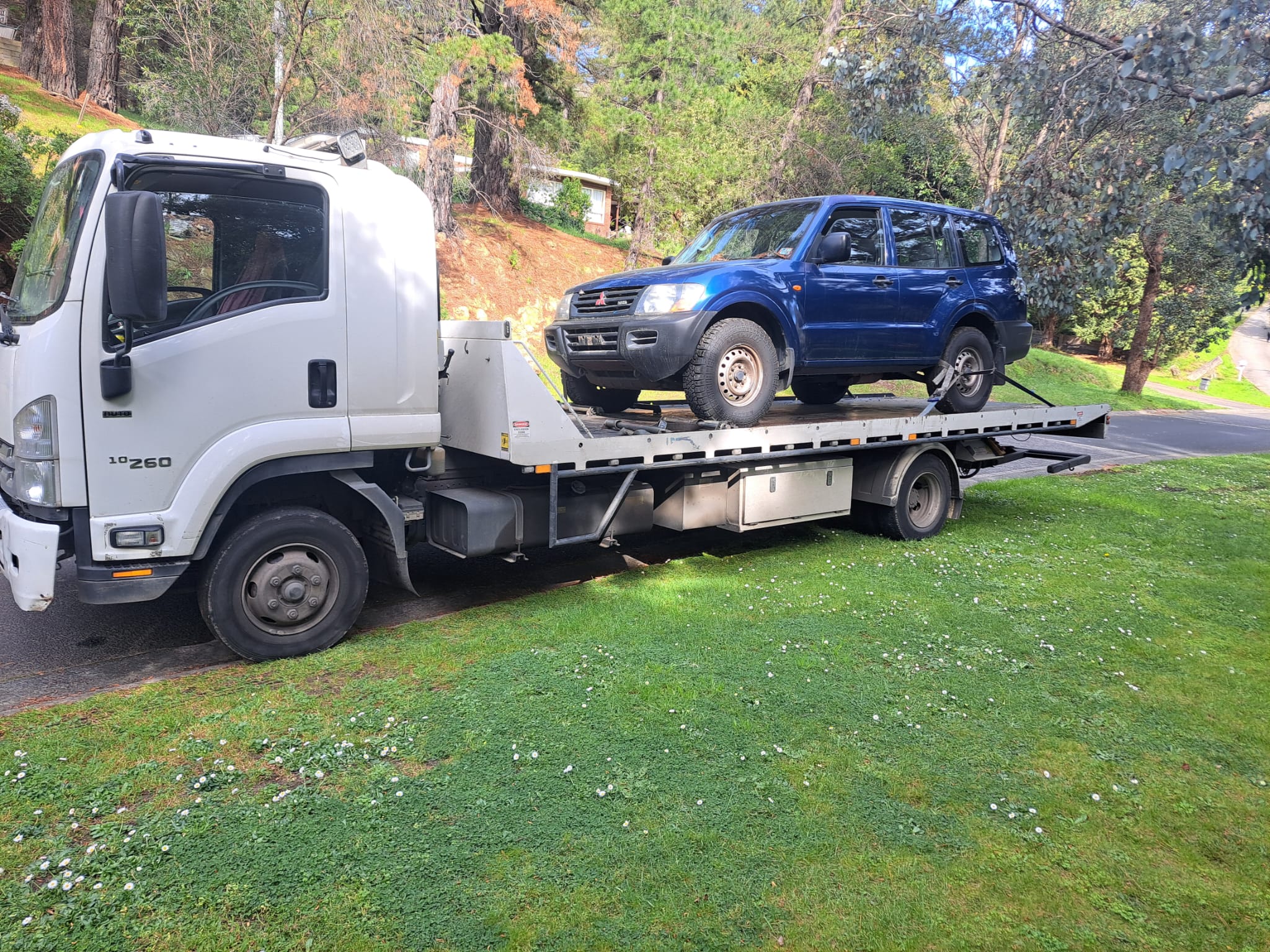 Blue 4WD on a True Blue tow truck for cash for cars pickup in Adelaide