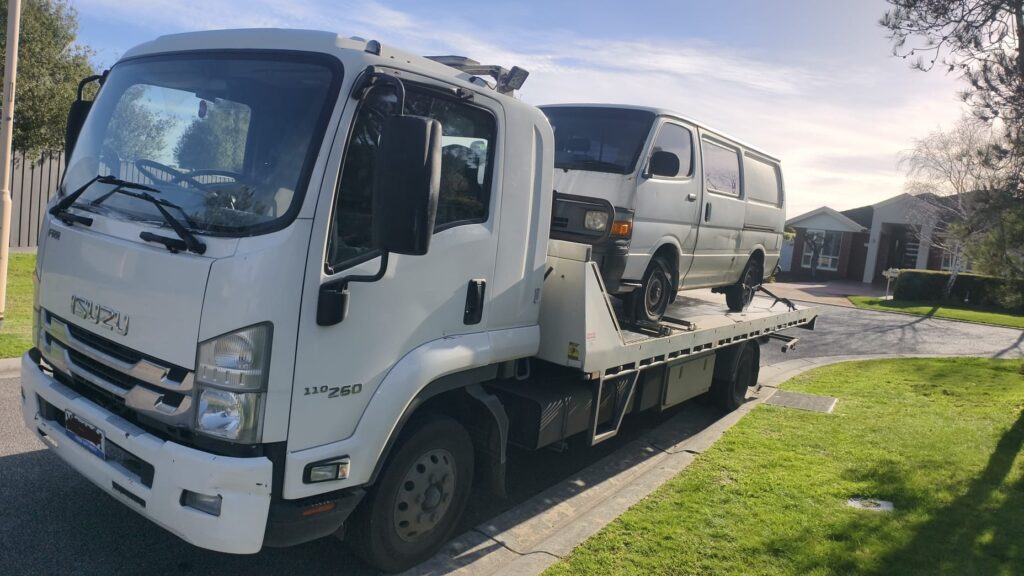 True Blue tow truck carrying a van for free car removal in Adelaide